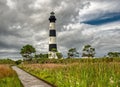 Lighthouse and boardwalk through the surrounding wetlands Royalty Free Stock Photo