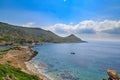 Lighthouse and boat in idyllic aegean sea in knidos