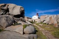 Lighthouse among the boulders on Lavezzi island, Corsica, France Royalty Free Stock Photo