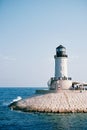 Lighthouse on the breakwater in Lustica Bay. Montenegro