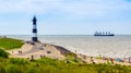 The lighthouse of Breskens with touristy beach during summer season, Breskens, Zeeland, The Netherlands, 20 July, 2020