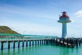 Lighthouse bridge stretching into the sea. Royalty Free Stock Photo