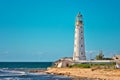 Lighthouse Building on seaside with Blue Sky on Background