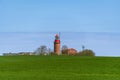 Lighthouse Buk On A Green Hill Royalty Free Stock Photo
