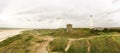 Lighthouse and bunker in the sand dunes on the beach of Blavand, Jutland Denmark Europe Royalty Free Stock Photo