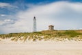 Lighthouse and bunker in the sand dunes on the beach of Blavand, Jutland Denmark Europe Royalty Free Stock Photo