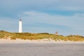 Lighthouse and bunker in the sand dunes on the beach of Blavand, Jutland Denmark Europe Royalty Free Stock Photo