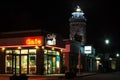 LIGHTHOUSE AND CAFES AT NIGHT
