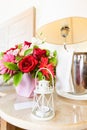 Lighthouse candle holder with champagne bottle and flower basket in the upscale hotel room. Being alone, getaway