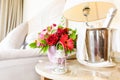 Lighthouse candle holder with champagne bottle and flower basket in the upscale hotel room. Being alone, getaway