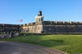 The lighthouse at Castillo San Felipe del Morro Fortress at sunset time in Old San Juan, Puerto Rico Royalty Free Stock Photo