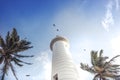 Lighthouse with clear blue sky and palm trees in Sri Lanka tourism port city Galle with colonial architecture Royalty Free Stock Photo