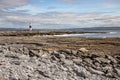 Lighthouse and cliffs of Moher in background in Inisheer island