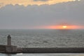 Lighthouse clouded Coast sunset colorfull pastell over ocean