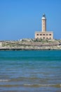 Lighthouse from the coast of Vieste on a sunny day, Puglia region, Italy Royalty Free Stock Photo