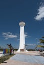 Lighthouse with colored lettering of tourist resort with marlin fish in Mahahual, Mexico