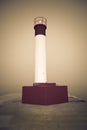 Lighthouse on a concrete pier on Lake Ontario Royalty Free Stock Photo