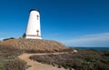 Lighthouse and curving walkway at Piedras Blancas point on the Central California Coast north of San Simeon California Royalty Free Stock Photo