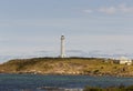 Lighthouse from a distance at augusta western australia on the horizon