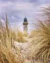 Lighthouse between dune grass. Rostock, WarnemÃÂ¼nde, Germany