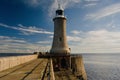 Lighthouse of the east british coast and Tynemouth pier, morning sunlight Royalty Free Stock Photo