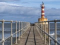 Lighthouse At The End Of Amble Pier Royalty Free Stock Photo