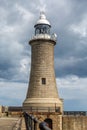 The Lighthouse at the end of the North Pier in Tynemouth, England, on a cloudy day Royalty Free Stock Photo