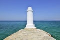 Pefkohori, Kassandra, Chalkidiki, Halkidiki, Greece. Lighthouse on the end of a pier in the Aegean Sea