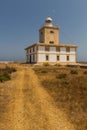 Lighthouse at the end of a road on the Island of Tabarca Royalty Free Stock Photo