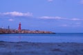 Lighthouse, evening twilight. Landscape with sea. Nature Royalty Free Stock Photo