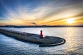 The lighthouse at the exit to the Baltic Sea in New Port at sunset, Gdansk. Poland Royalty Free Stock Photo