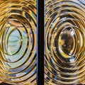 Lighthouse glass photographed front on as a mirror of each showing concentric rings of thickened glass, to illuminate and magnify