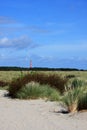 Lighthouse above grass