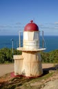 The lighthouse on grassy hill near the town of Cooktown. Royalty Free Stock Photo