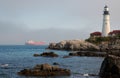 Lighthouse Guides Oil Tanker Vessel Out of Fog