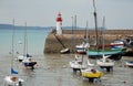 Lighthouse harbor and boats Royalty Free Stock Photo