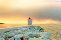 Lighthouse in the harbor of a small town called Postira shot at sunset - Croatia, island Brac Royalty Free Stock Photo