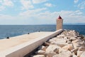 Lighthouse in the harbor of a small town - Croatia, island Brac