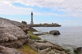 Lighthouse and hause on the small island in Baltic Sea. Architecture of Osmussaar, Estonia, Europe. Royalty Free Stock Photo