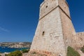 Lighthouse on a hill over Mediterranian sea. Scene view of sunny coastline