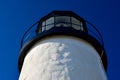 White Lighthouse Against a Deep Blue Cloudless Sky Royalty Free Stock Photo