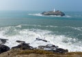 Lighthouse and island Cornwall coast England UK