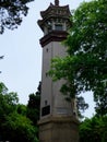 A lighthouse with lake and blue sky background Royalty Free Stock Photo