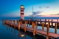 Lighthouse at Lake Neusiedl, Podersdorf am See, Burgenland, Austria. Lighthouse at sunset in Austria. Wooden pier with lighthouse