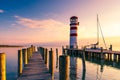 Lighthouse at Lake Neusiedl, Podersdorf am See, Burgenland, Austria. Lighthouse at sunset in Austria. Wooden pier with lighthouse