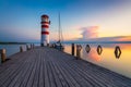 Lighthouse at Lake Neusiedl, Podersdorf am See, Burgenland, Austria. Lighthouse at sunset in Austria. Wooden pier with lighthouse Royalty Free Stock Photo