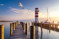 Lighthouse at Lake Neusiedl at sunset near Podersdorf with sea gulls flying around the lighthouse. Burgenland, Austria Royalty Free Stock Photo