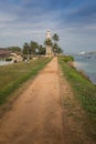 Lighthouse with light beam at sunset Royalty Free Stock Photo