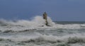 The lighthouse of the Mangiabarche shrouded by the waves of a mistral wind storm Royalty Free Stock Photo