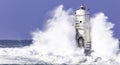 The lighthouse of the Mangiabarche shrouded by the waves of a mistral wind storm Royalty Free Stock Photo